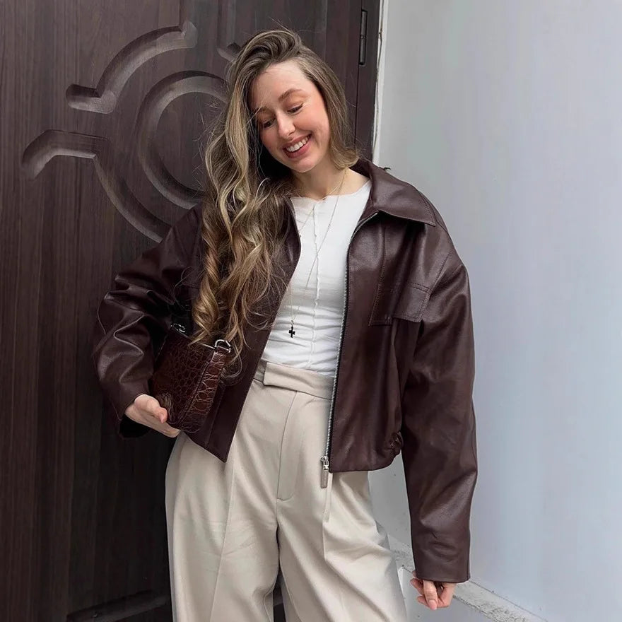 Giacca in pelle vintage con cintura in vita solida Moda donna Colletto alla coreana Manica intera Cappotto con fibbia con cerniera 2026 Lady Street Capispalla